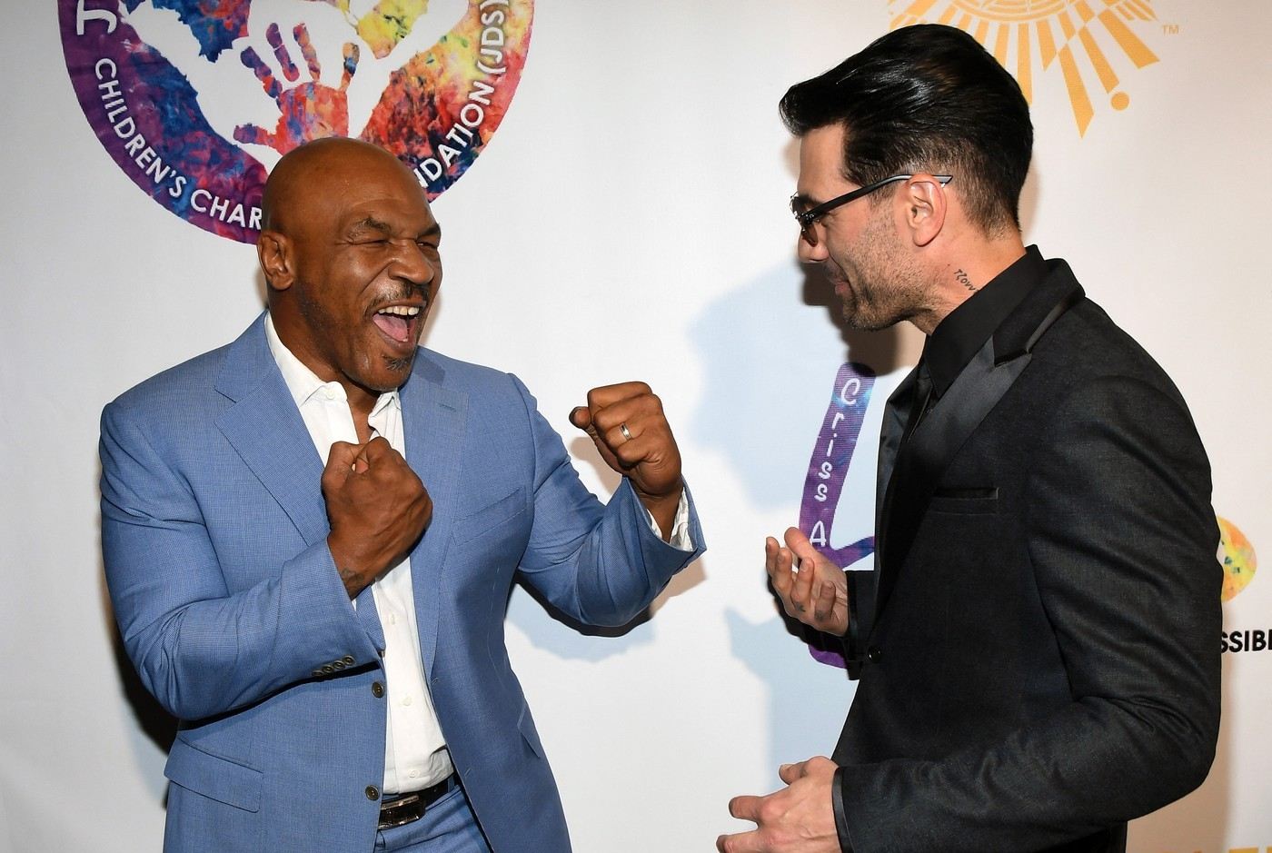 Bývalý boxer Mike Tyson (vlevo) a iluzionista Criss Angel.